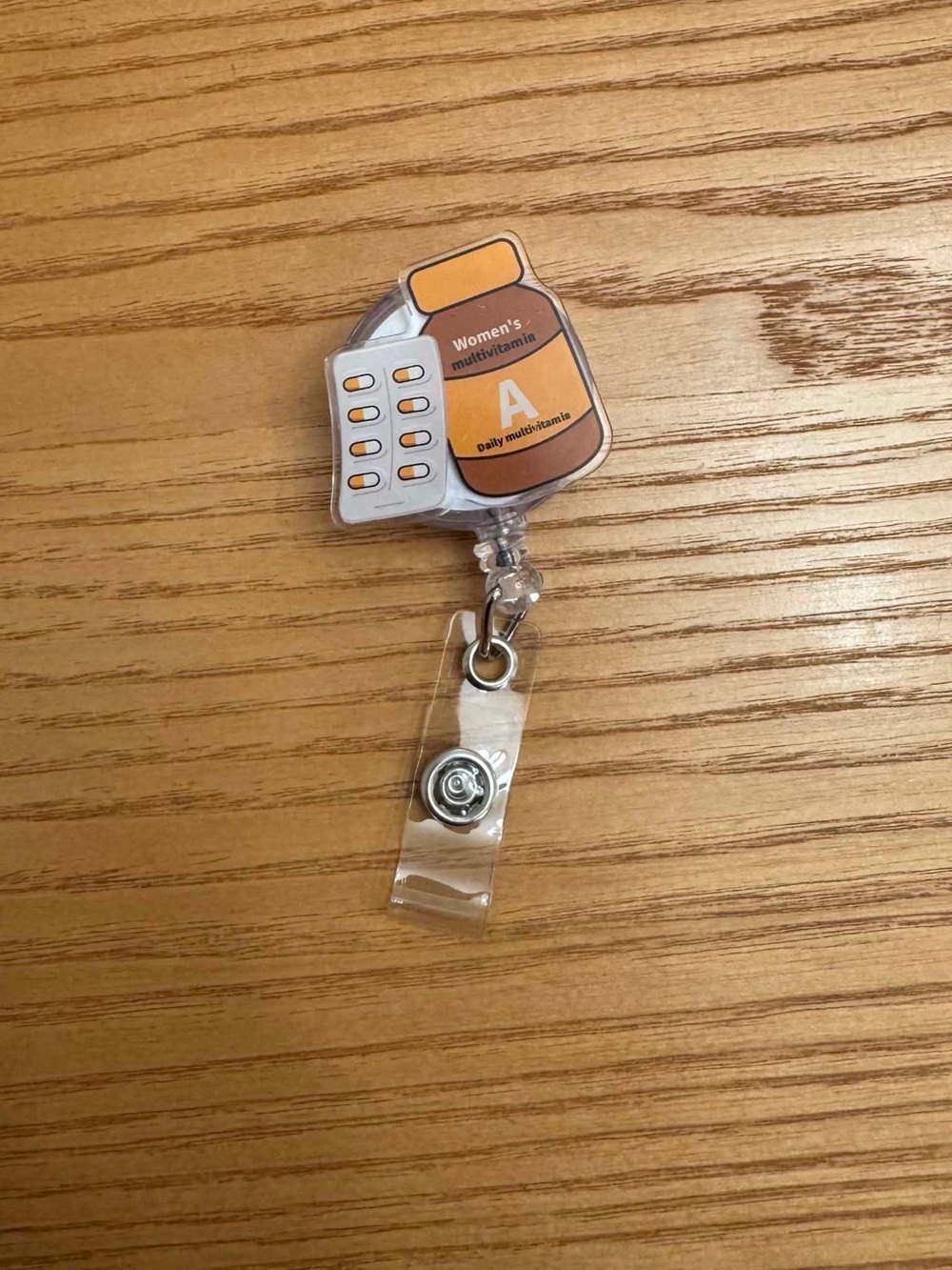 Vitamin Bottle Badge Reel - Orange and White retractable ID clip Nurse